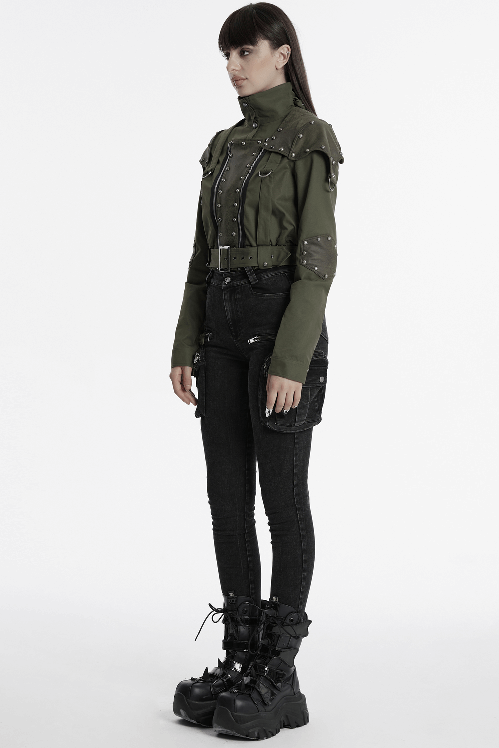 Military style short jacket with distressed rivets, adjustable collar, and punk flair, paired with sleek black jeans.