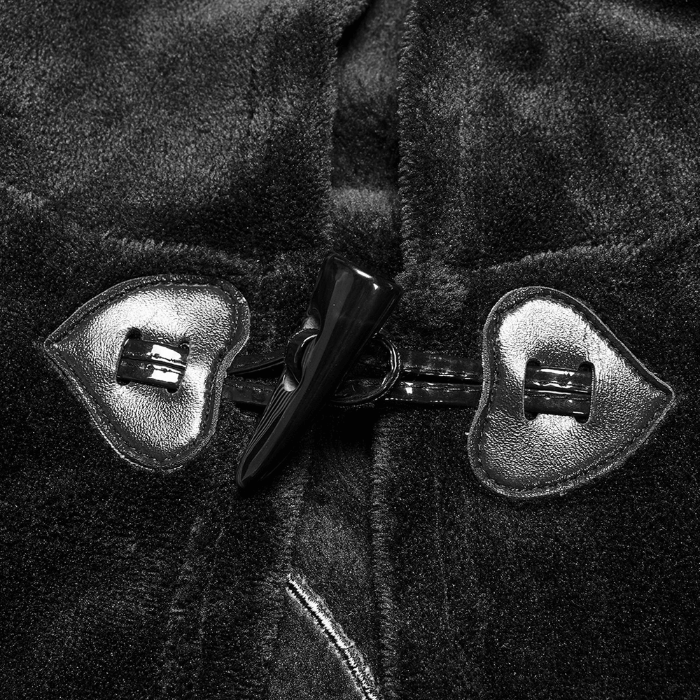 Close-up of the heart-shaped clasps on the Moon Embroidered Dark Velvet Hooded Cloak Jacket.