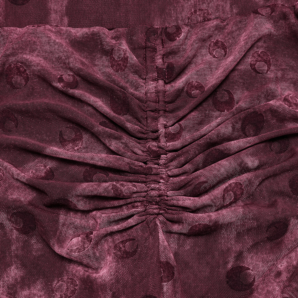 Close-up of moon printed mesh fabric with gathered detail, featuring crescent designs for stylish flare pants.