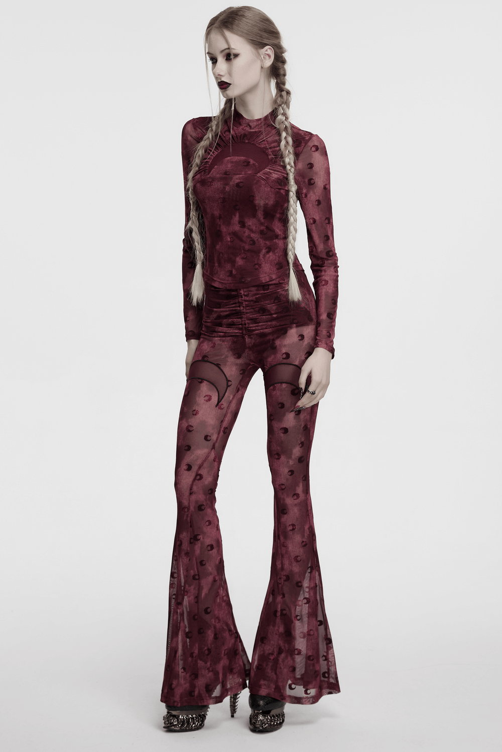 Moon printed flare pants with crescent embroidery, featuring a stylish mesh design and a bold burgundy color.
