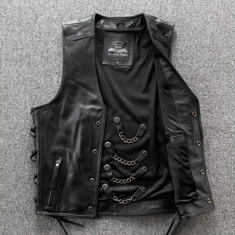Moto biker leather men's vest in solid black with stylish chains and buttons, perfect for riding.