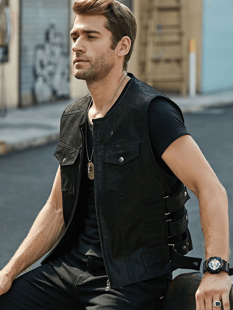 Stylish man wearing a black leather motorcycle vest with zipper, showcasing edgy punk fashion.