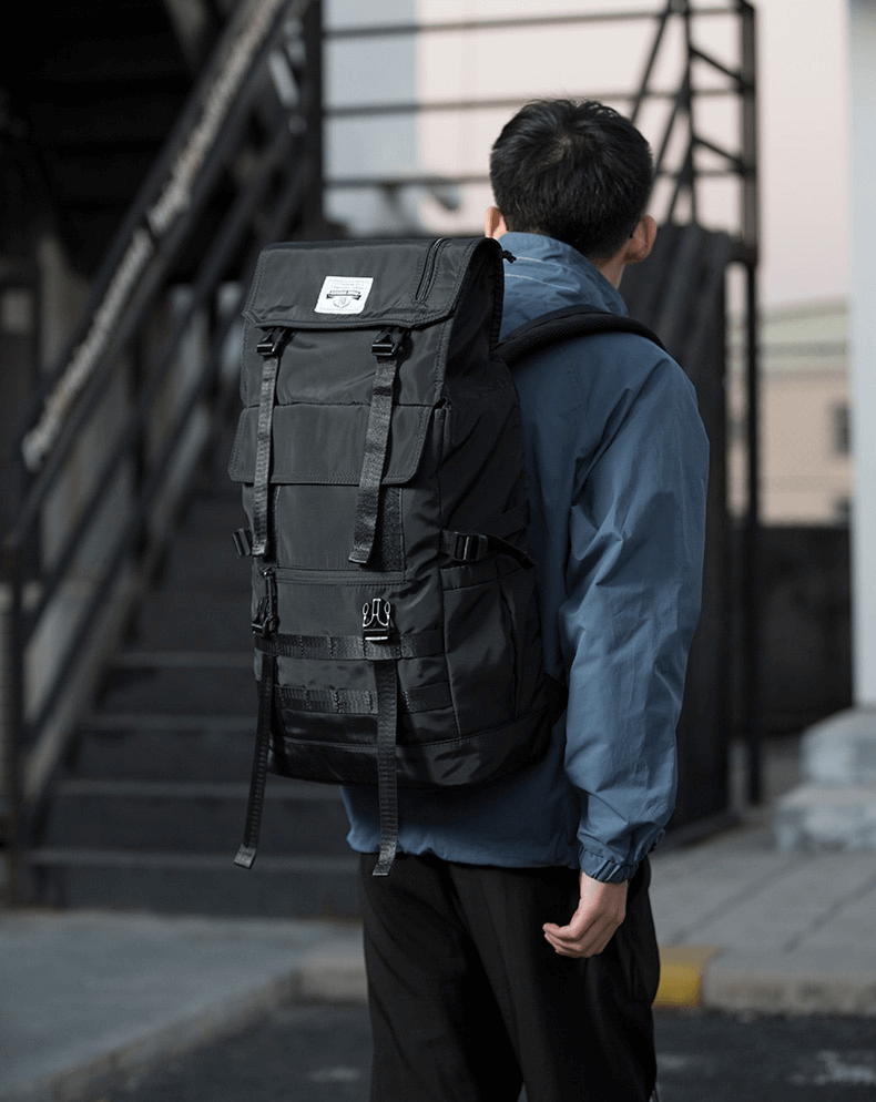 Stylish unisex motorcycle waterproof backpack worn by a man, perfect for travel and adventures.