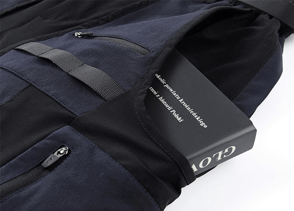 Close-up of multi-pocket tactical cargo shorts with a book tucked into the pocket, showcasing style and functionality.