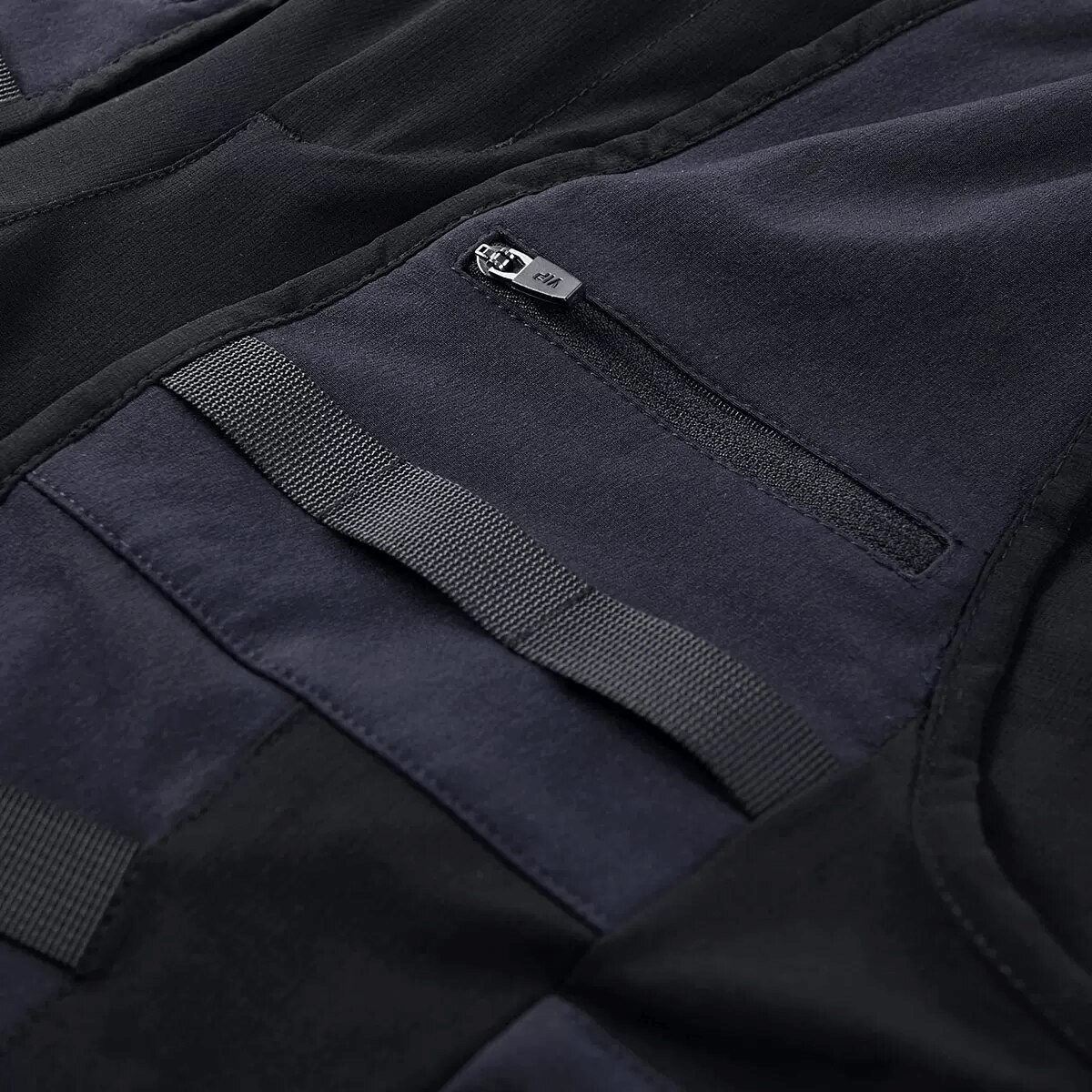 Close-up of multi-pocket design and zipper of tactical cargo shorts, showcasing stylish and functional details.