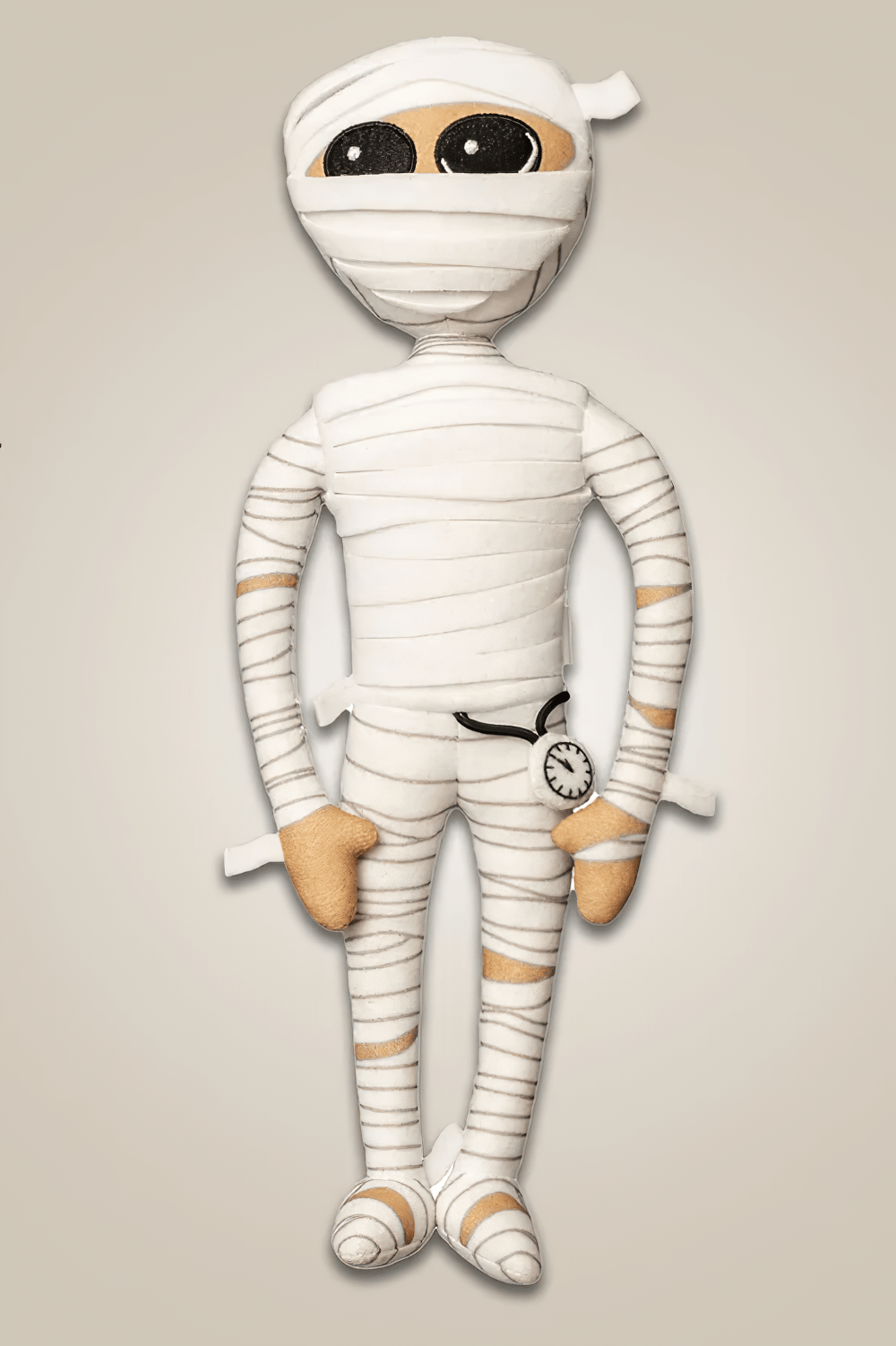 Mummington Mummy Plush Doll with Glow in the Dark Watch, whimsical mummy plush holding a glow-in-the-dark watch.