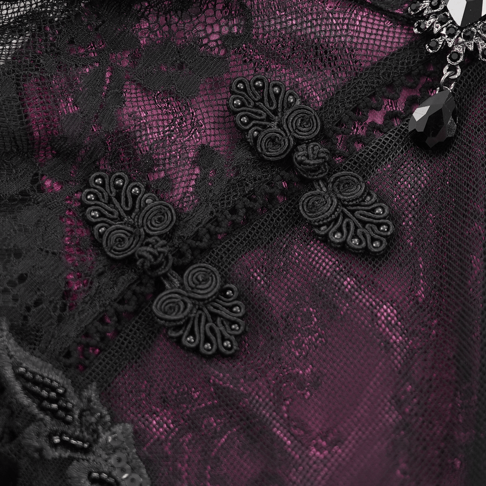 Intricate black lace and purple fabric detail of a Gothic lace cheongsam dress with decorative accents.