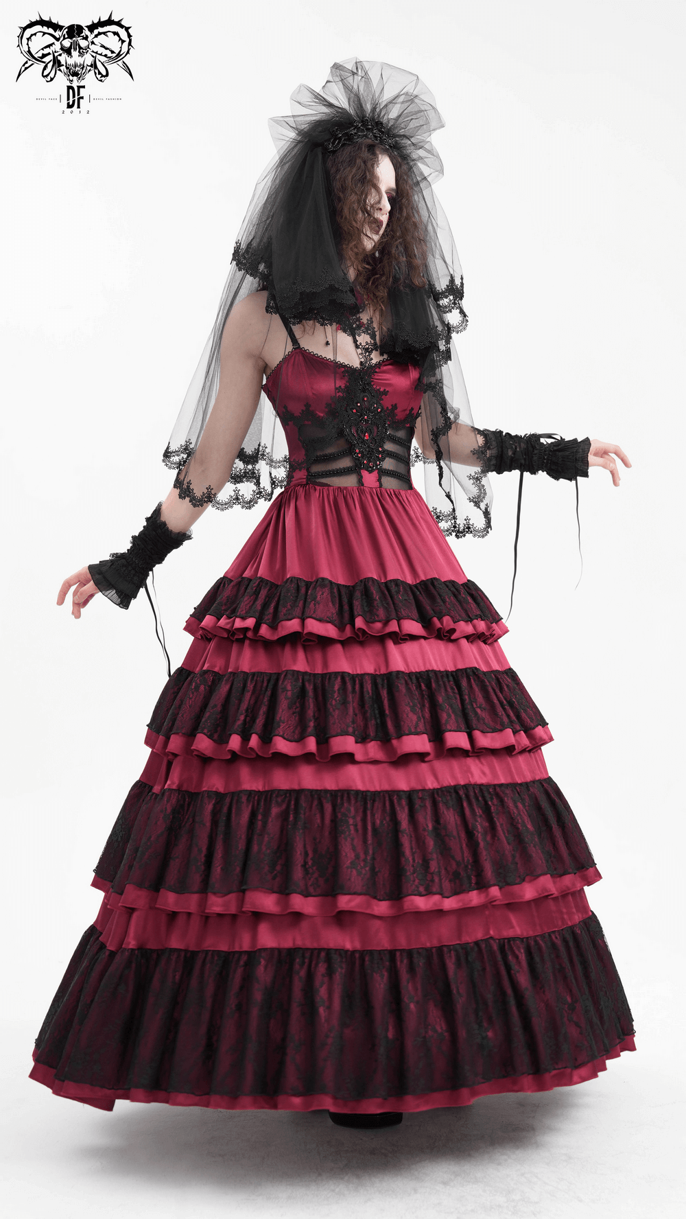 Elegant black lace bridal veil paired with a dramatic layered burgundy gown, perfect for a striking wedding look.