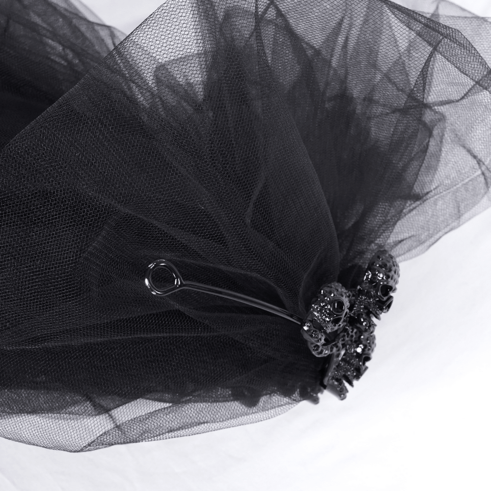 Elegant black lace bridal veil with intricate details and a stunning embellishment, perfect for chic weddings.