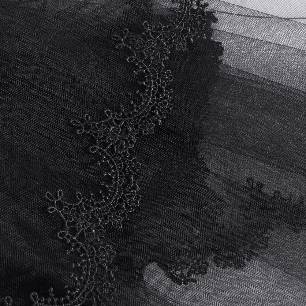Elegant black lace detailing on a chic bridal veil, perfect for adding sophistication to any wedding outfit.