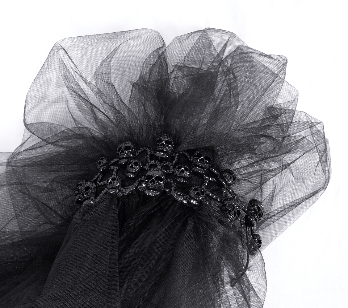Chic black bridal veil with skull detailing and tulle, perfect for a unique wedding look.