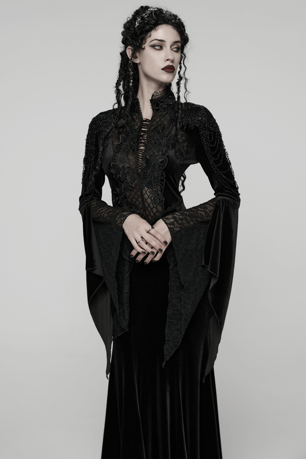Mystery Long Black Velvet Lace Dress with Fishtail Hem worn by model, showcasing its gothic elegance and dramatic silhouette.