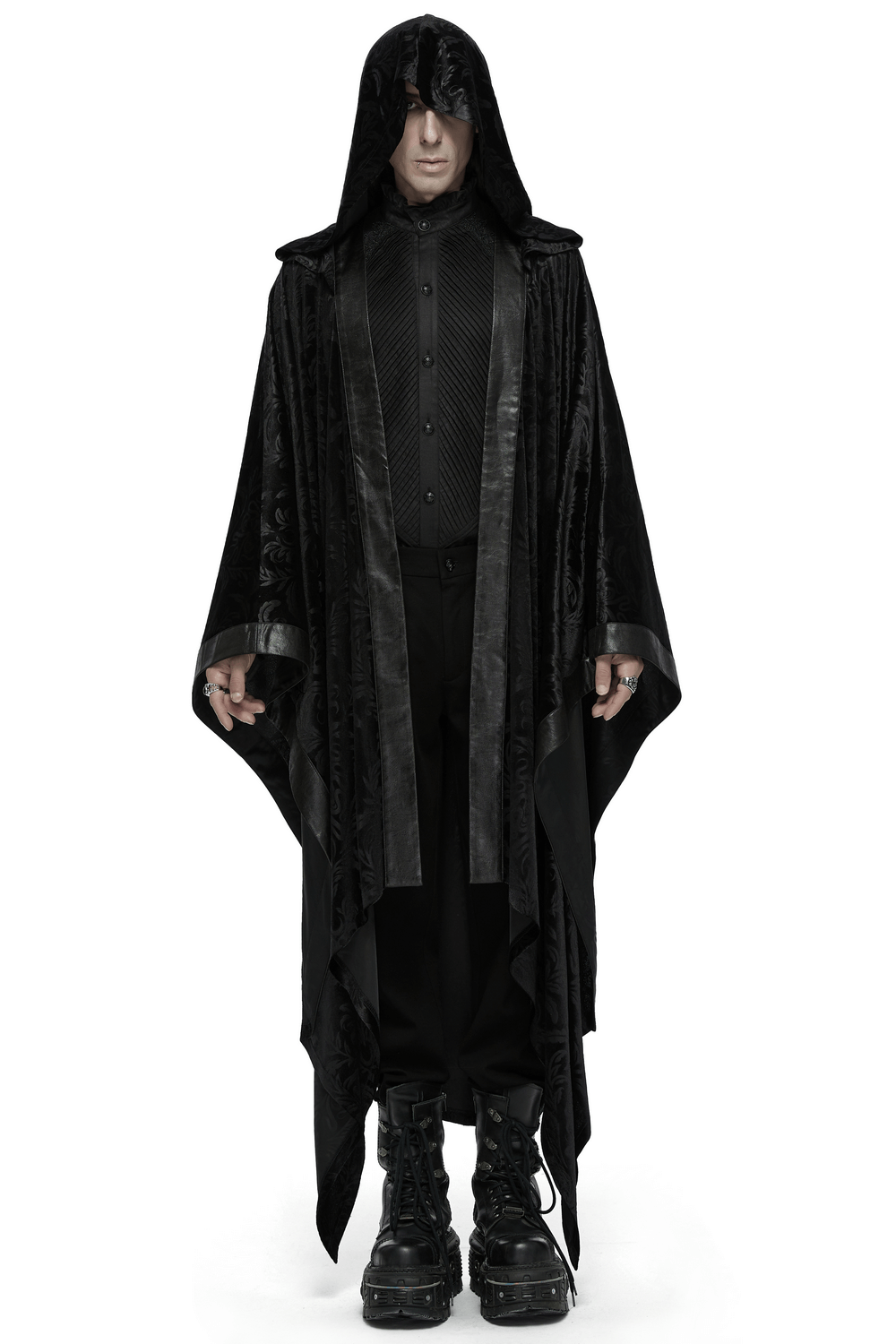 Mysterious figure in a dark hooded velvet cape, exuding gothic elegance and shadowy allure. Perfect for dark fashion enthusiasts.