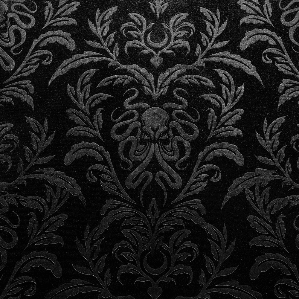 Elegant black embossed velvet fabric with gothic floral and skull pattern, perfect for dark-themed designs.