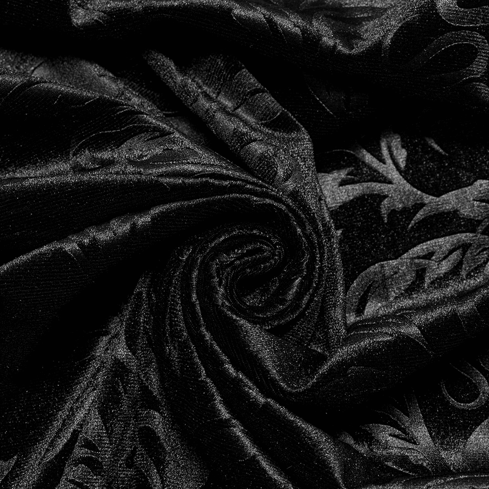 Close-up of luxurious black velvet fabric with gothic embossed patterns, ideal for stylish gothic attire.