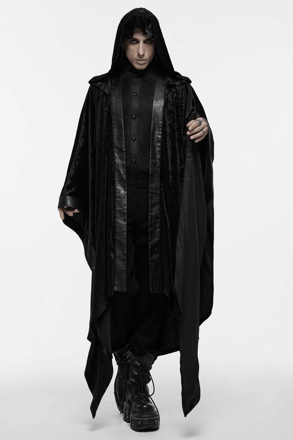 Man wearing a stunning hooded Mystic Velvet Cape, embodying gothic elegance with a dramatic silhouette in dark hues.