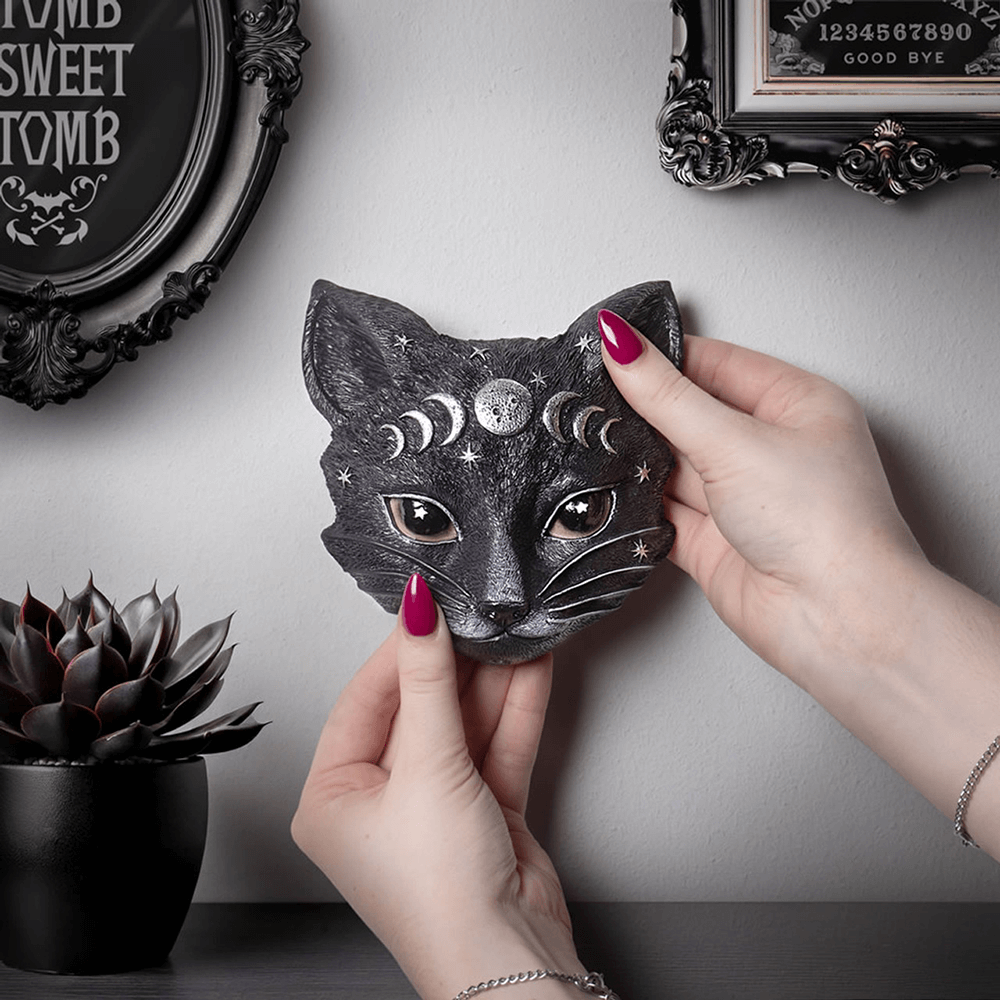 Hand-painted Mystic Moon Cat Masque ornament, perfect for witchy decor, displaying lunar phases and starry eyes.