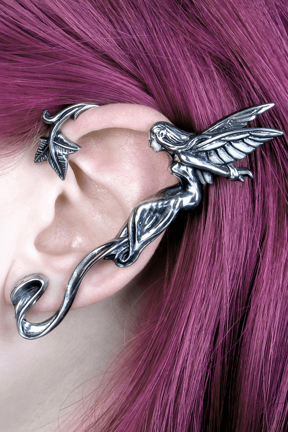 Antiqued pewter fairy ear wrap with leafy scroll detail, designed for the left ear, on a model with purple hair.