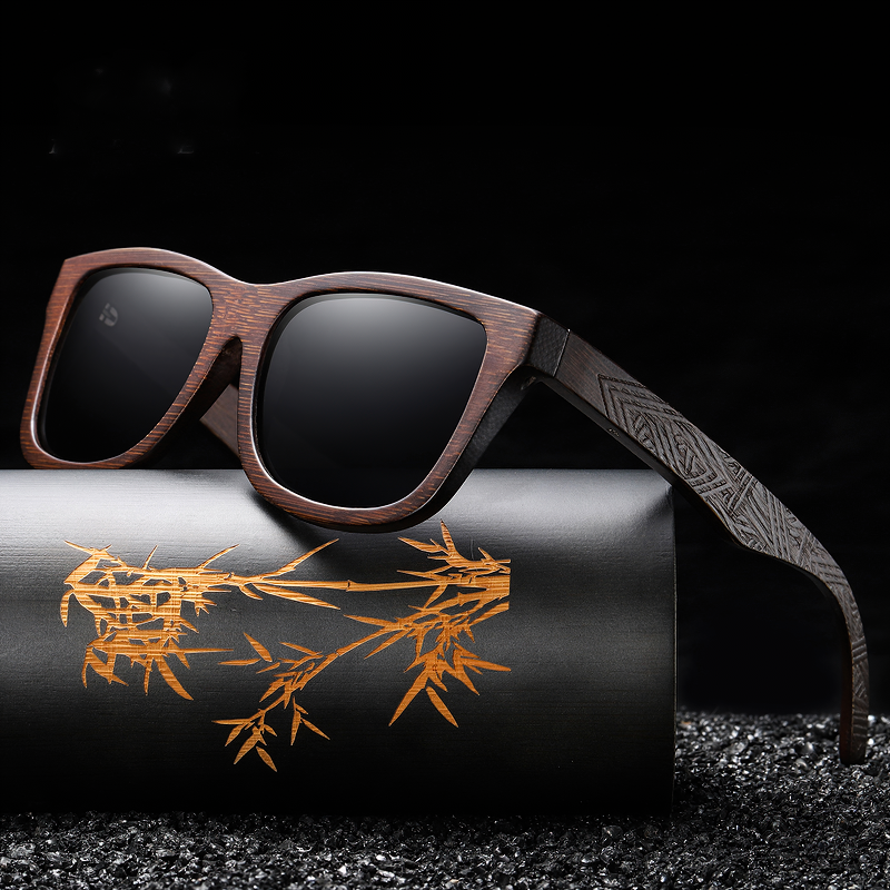 Stylish natural bamboo wooden sunglasses with polarized lenses, resting on a luxurious black gift box.