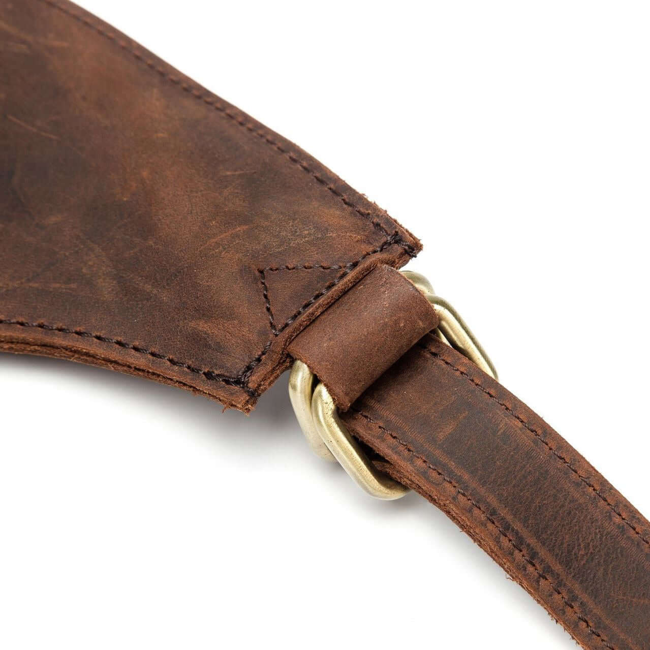 Close-up of the strap of a natural leather backpack for women, showcasing its vintage style and durable stitching.