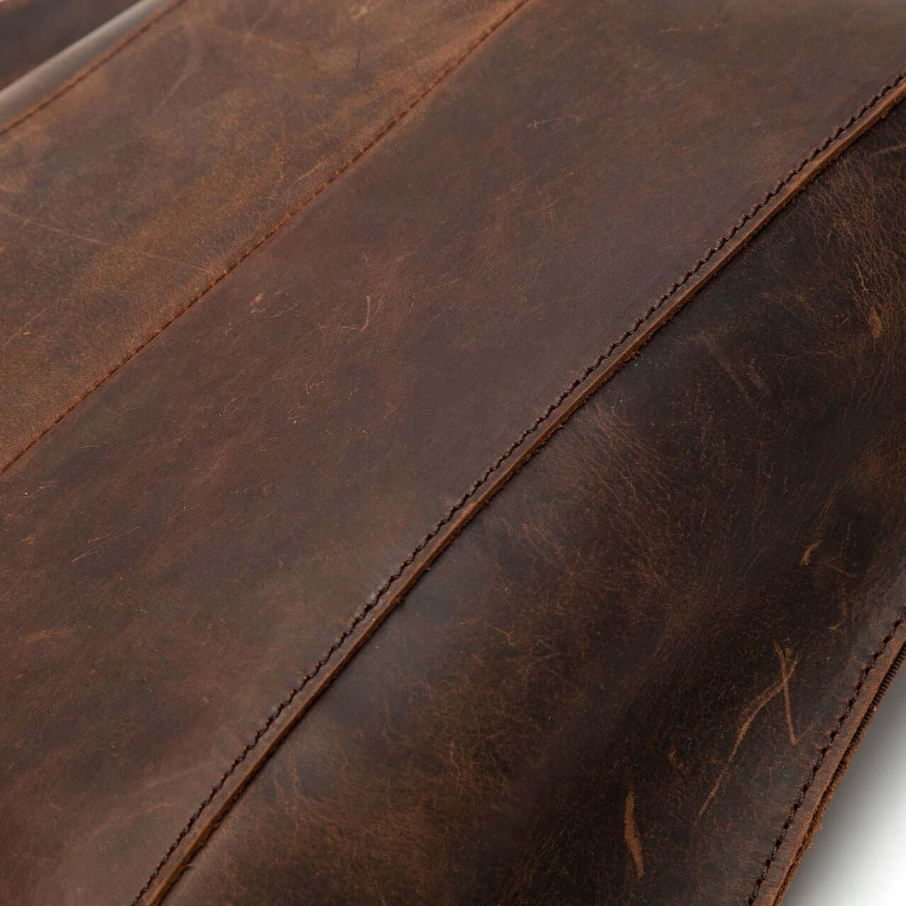 Close-up of natural leather showing rich texture and vintage appeal of the anti-theft leather backpack for women.