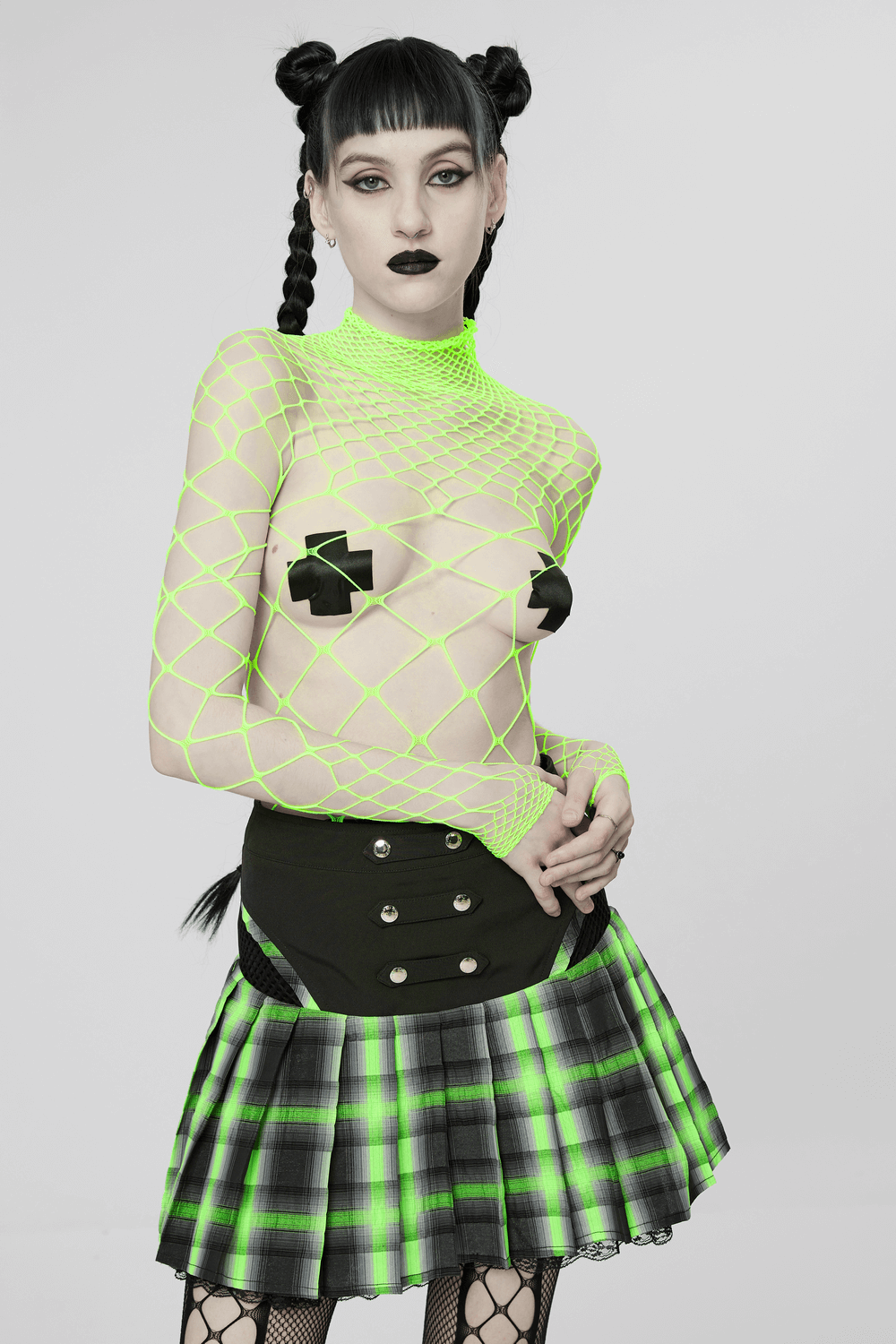 Neon green mesh bodysuit with daring long sleeves and edgy plaid skirt, perfect for bold punk style.