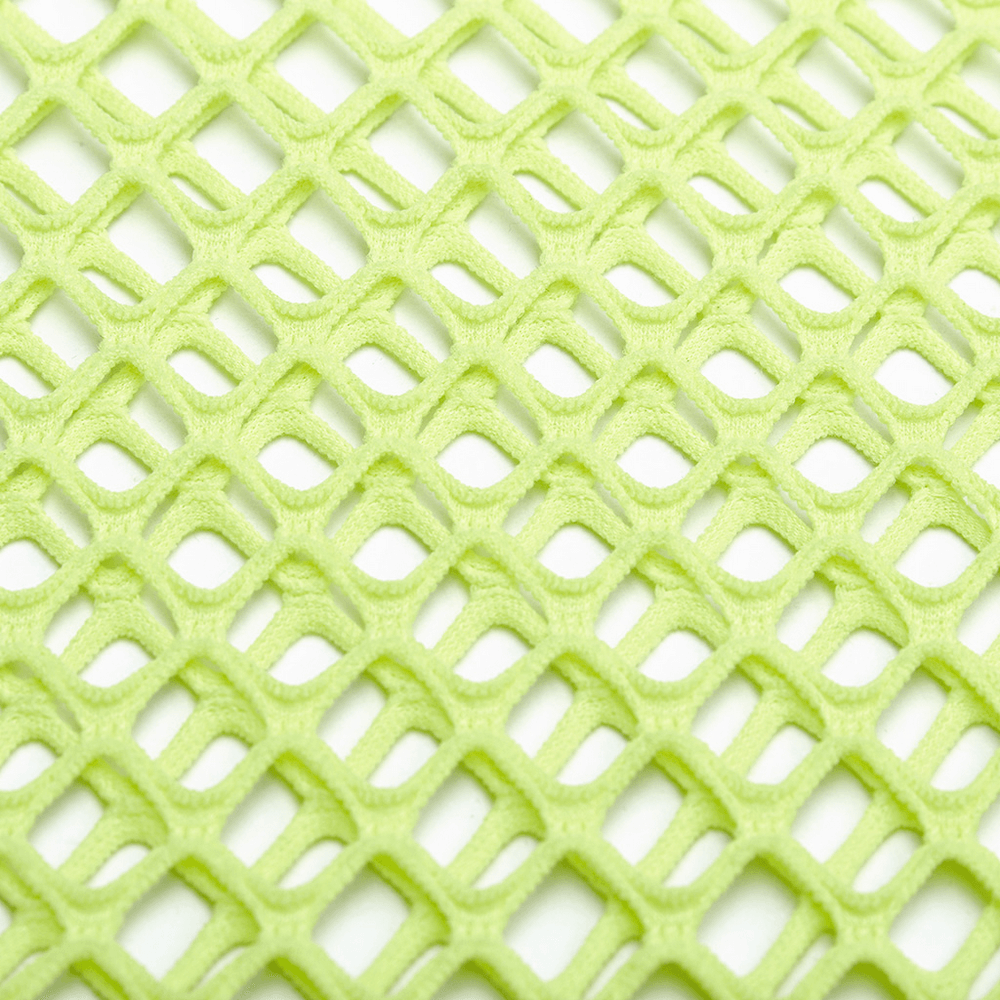 Close-up of neon green coarse mesh fabric, showcasing its punk-inspired fishnet design.