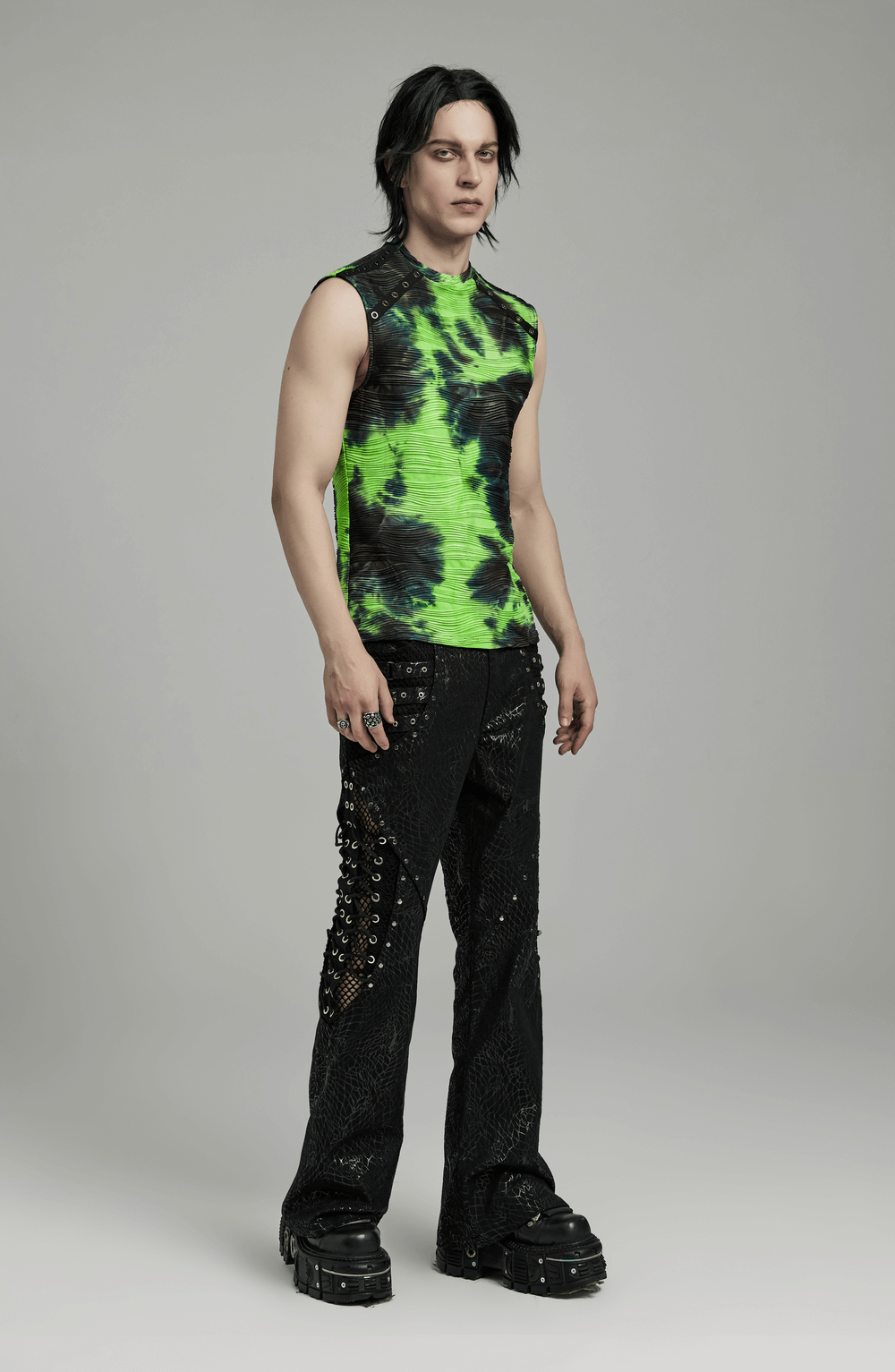 Neon green tie dye sleeveless tank top with rivet details, styled for cyber or rave fashion.