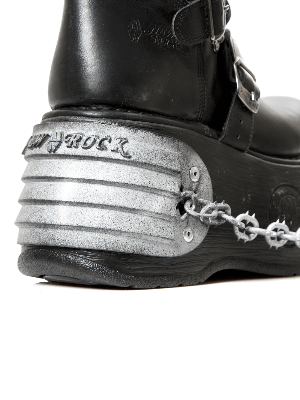 Close-up of NEW ROCK Gothic platform boots showcasing chains and metallic heel design.