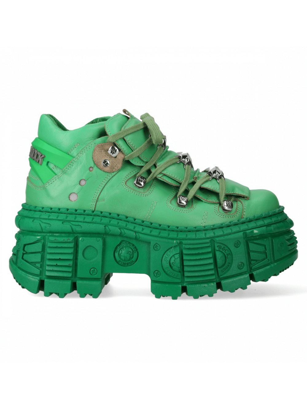 Stylish green chunky sneakers with thick sole and lace-up design for a trendy rock-inspired look.