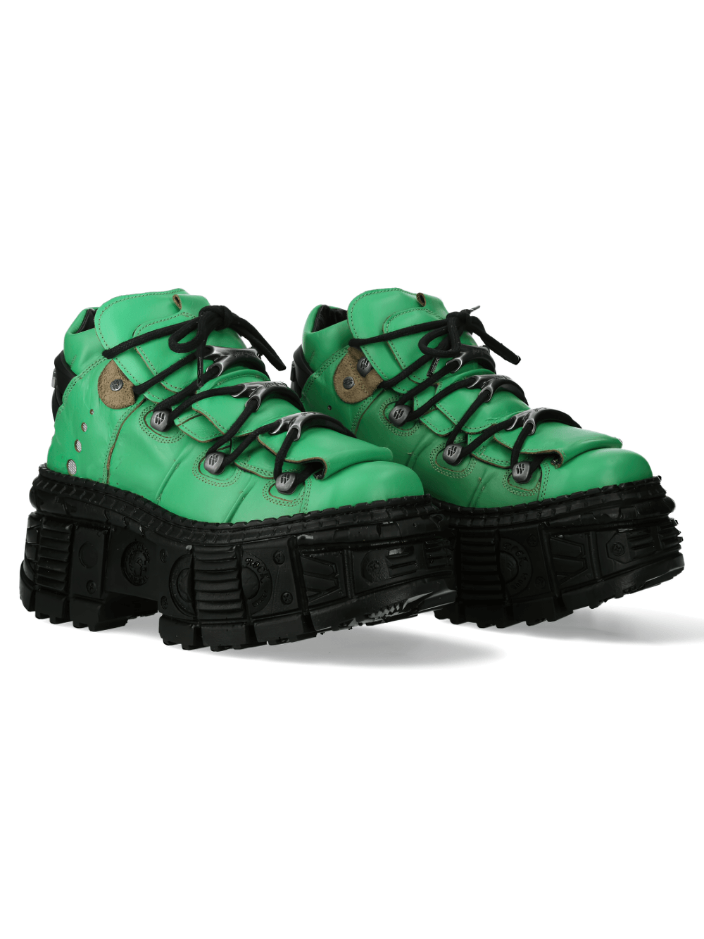 Stylish green platform ankle boots with rocker design and durable black sole for urban fashion.