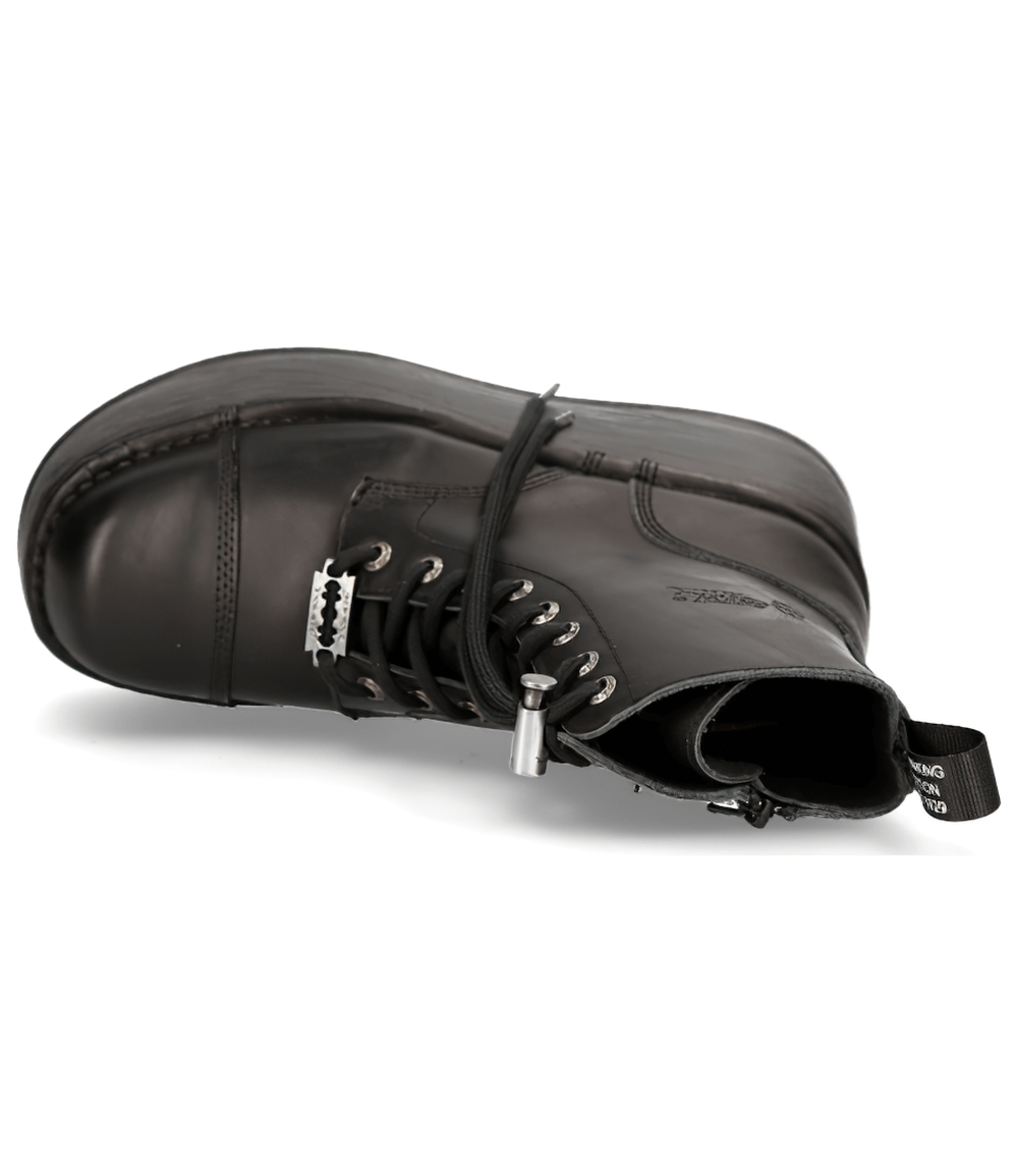 Black chunky platform ankle boots with lace-up design and zipper, showcasing military punk style.