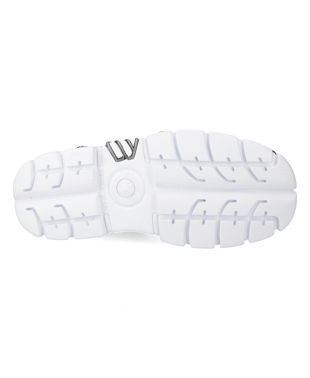 Sole of a modern white athletic shoe showcasing its grip and design features.