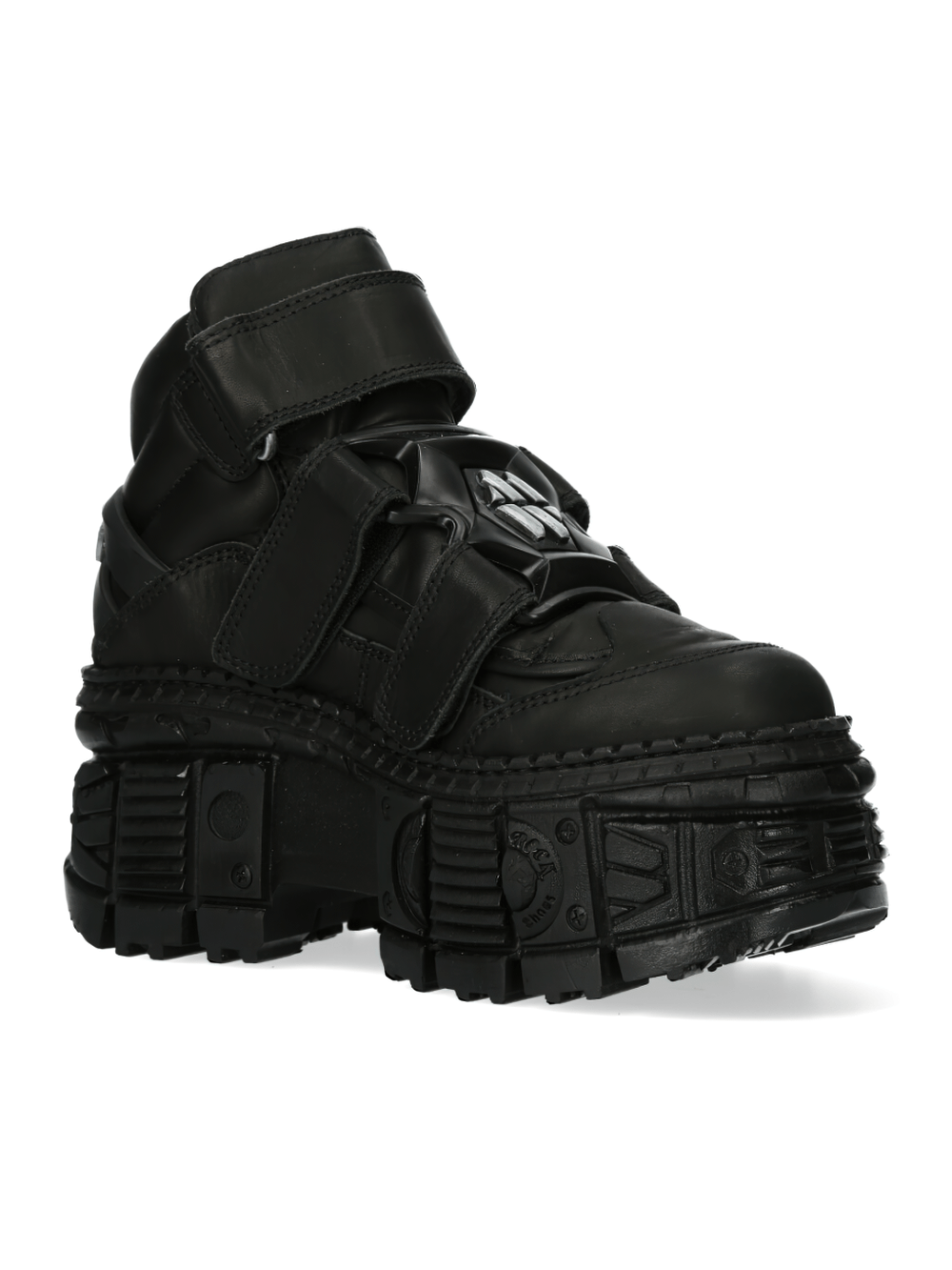 Trendy black ankle boots with Velcro straps, urban style, and chunky sole, perfect for bold fashion statements.