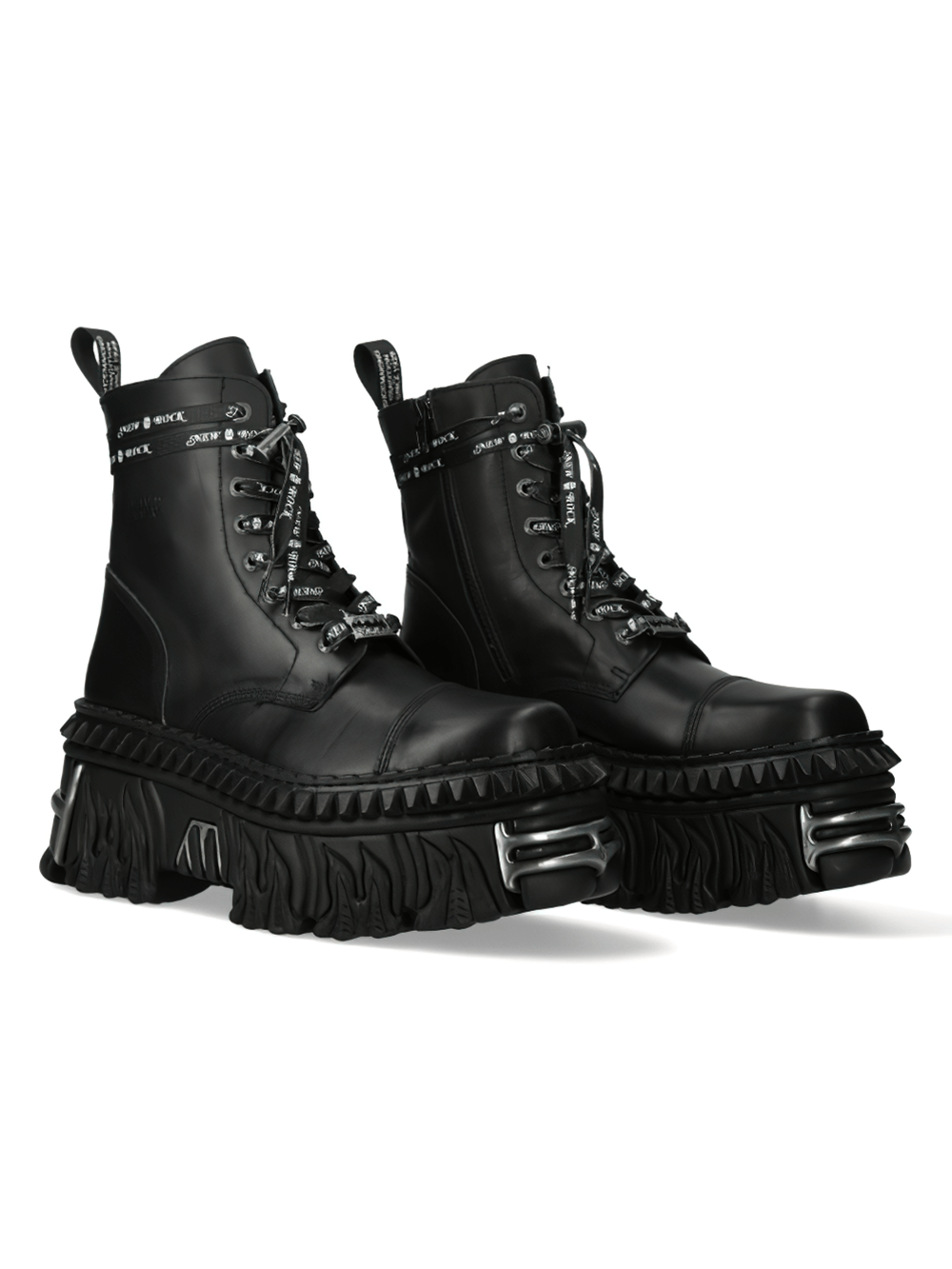 Bold black gothic platform boots with dramatic ruffled soles and military-inspired details.