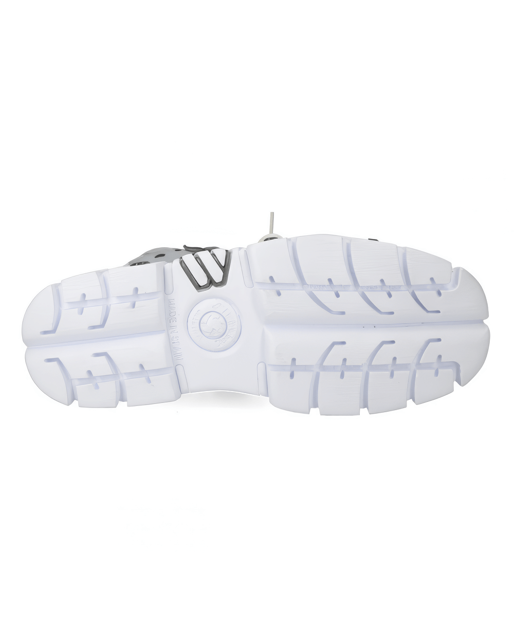 Sleek white sneaker outsole showcasing durable tread and stylish design for optimal grip and comfort.