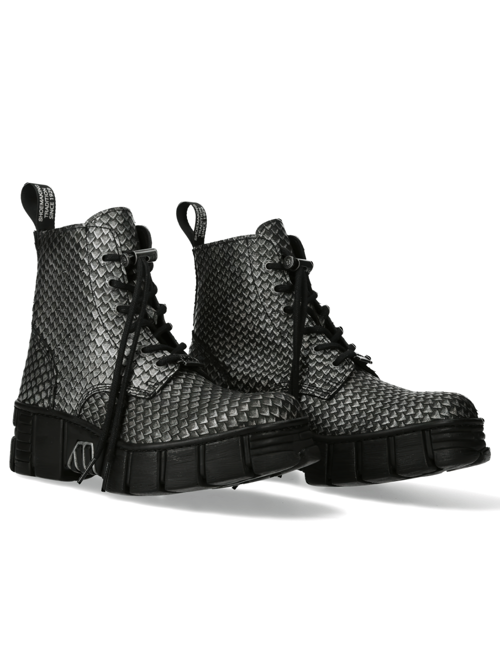Black lace-up urban boots with textured scale design, perfect for edgy street style enthusiasts.
