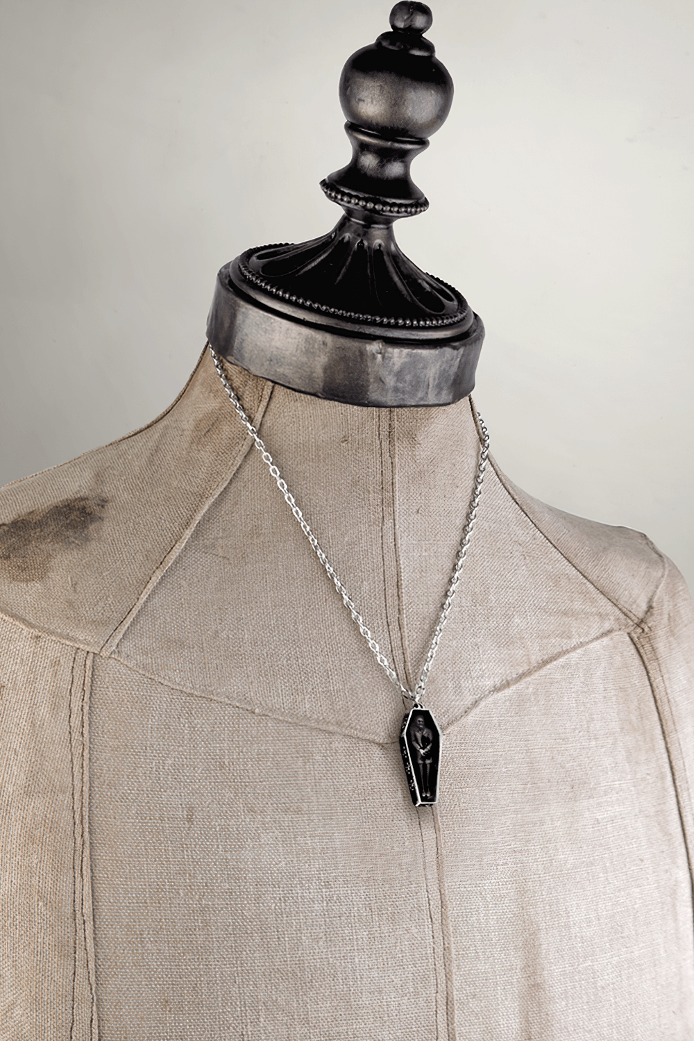 Gothic vampire jewelry featuring Nosferatu's Rest coffin pendant on a display mannequin.
