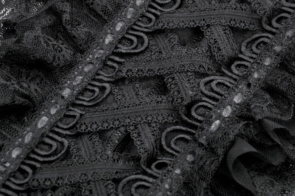 Close-up of black lace fabric featuring intricate ribbon details and gothic patterns, perfect for a unique top.