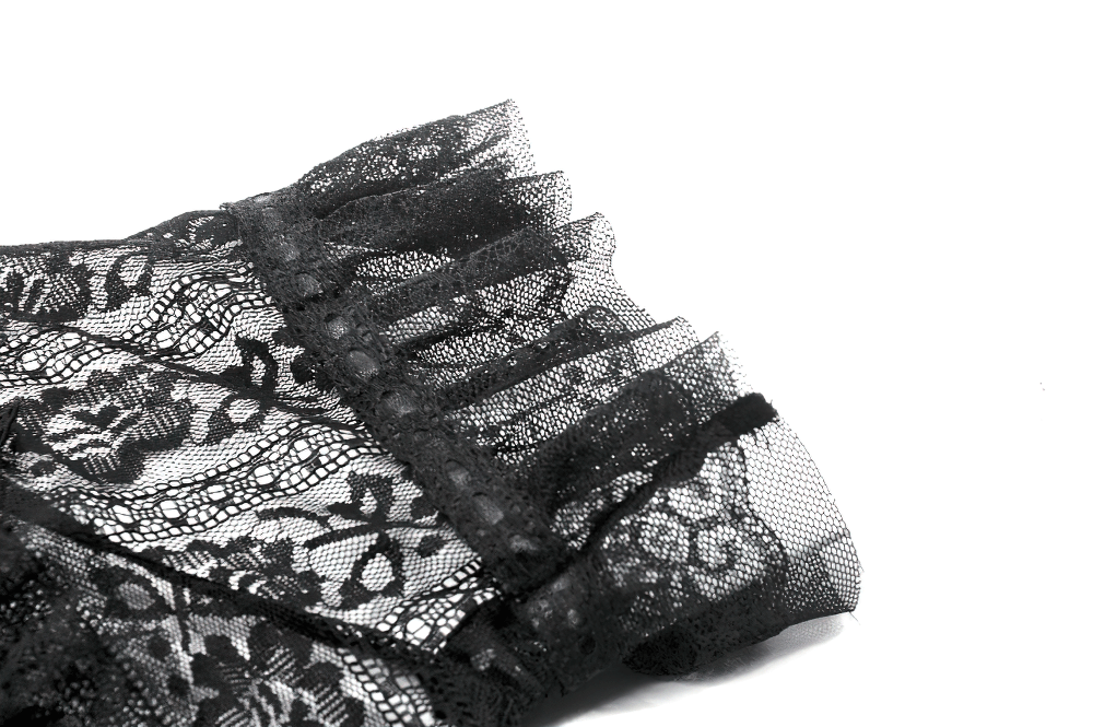 Close-up of intricate black lace detailing with ribbon trim, showcasing Gothic style elegance.