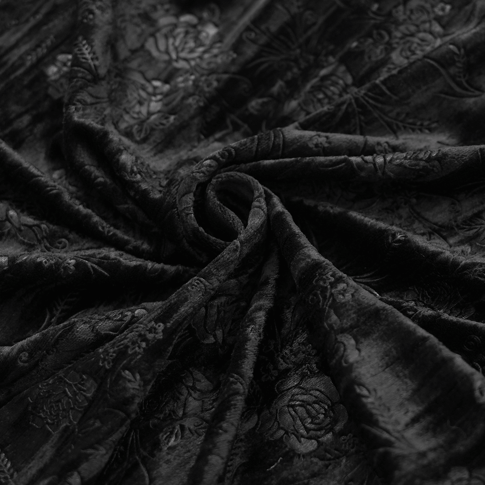 Rich black velvet fabric with intricate floral patterns, perfect for gothic fashion and elegant designs.