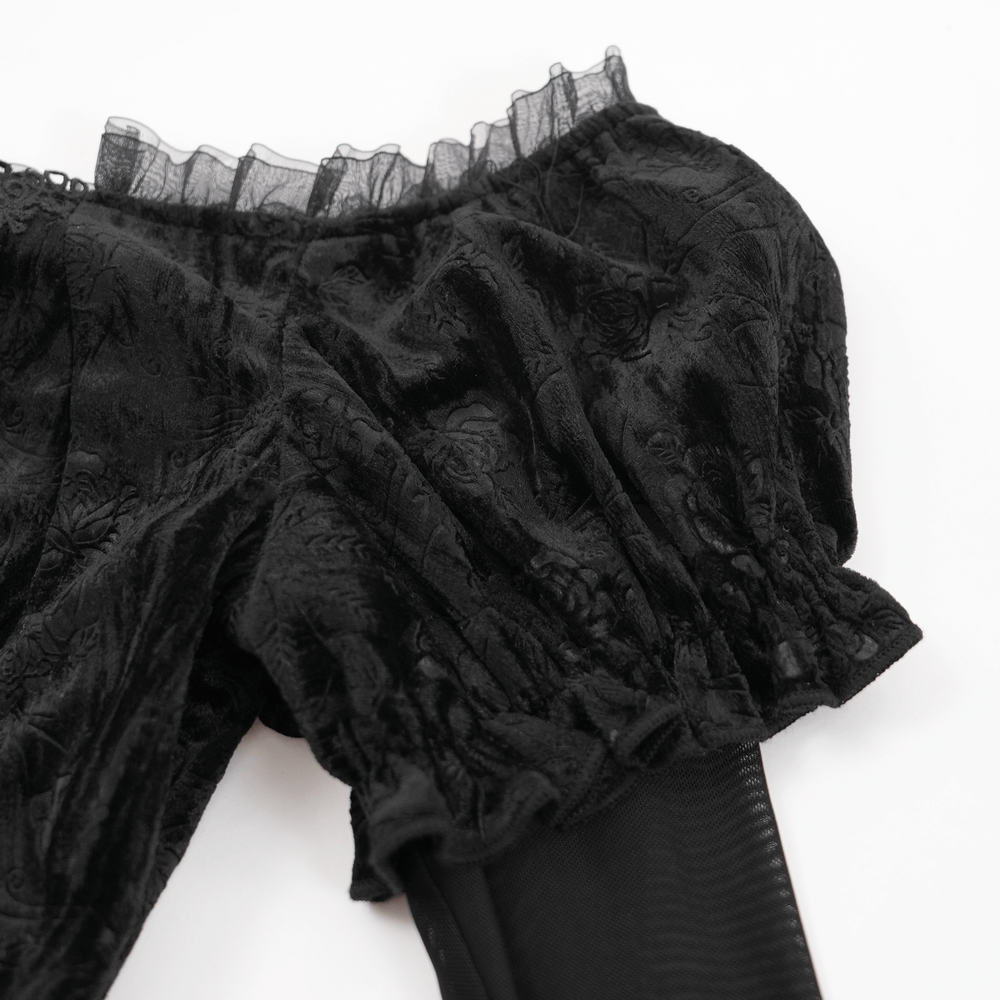 Off-shoulder black velvet top with sheer mesh bell sleeves and lace trim, perfect for gothic elegance.