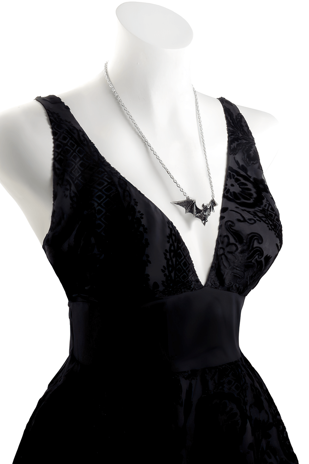 Elegant black dress showcasing Om Strygia pewter bat pendant necklace with raised wings for a gothic vibe.