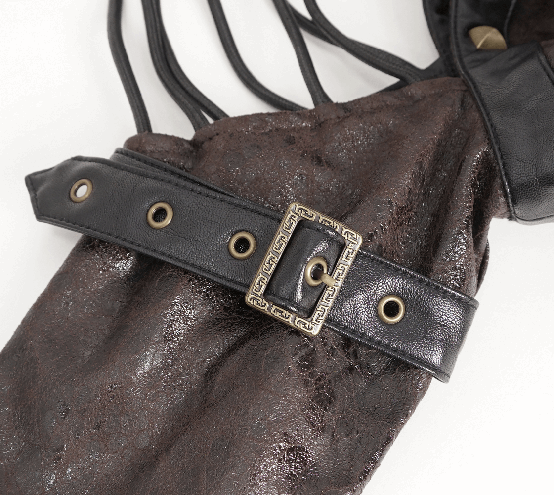 Close-up of dramatic gothic one-shoulder accessory with spikes, featuring a stylish black belt and brown fabric.