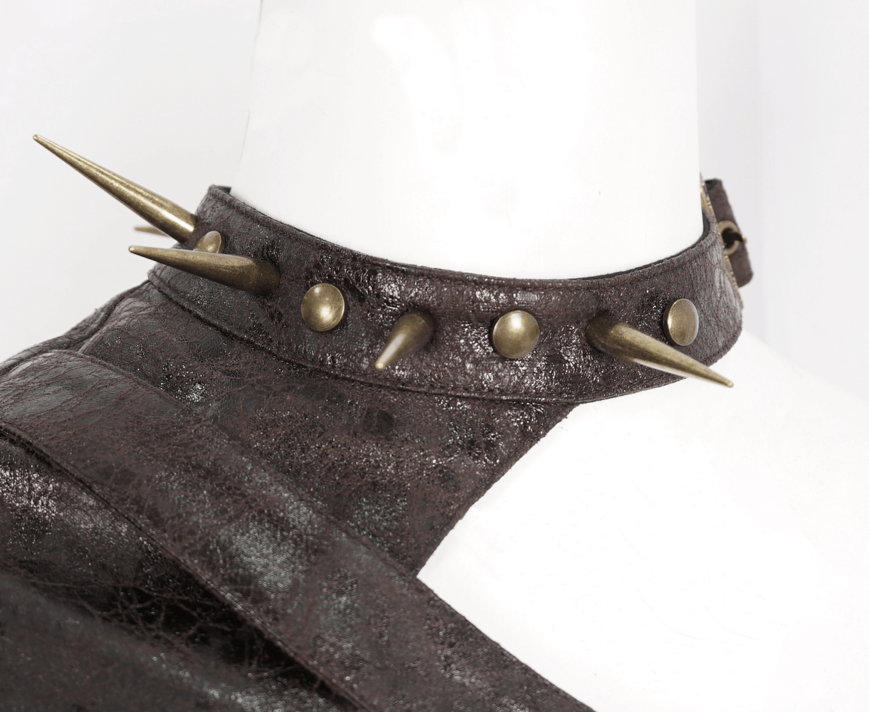 Dramatic gothic one-shoulder accessory featuring spikes and studs for a bold, punk style.