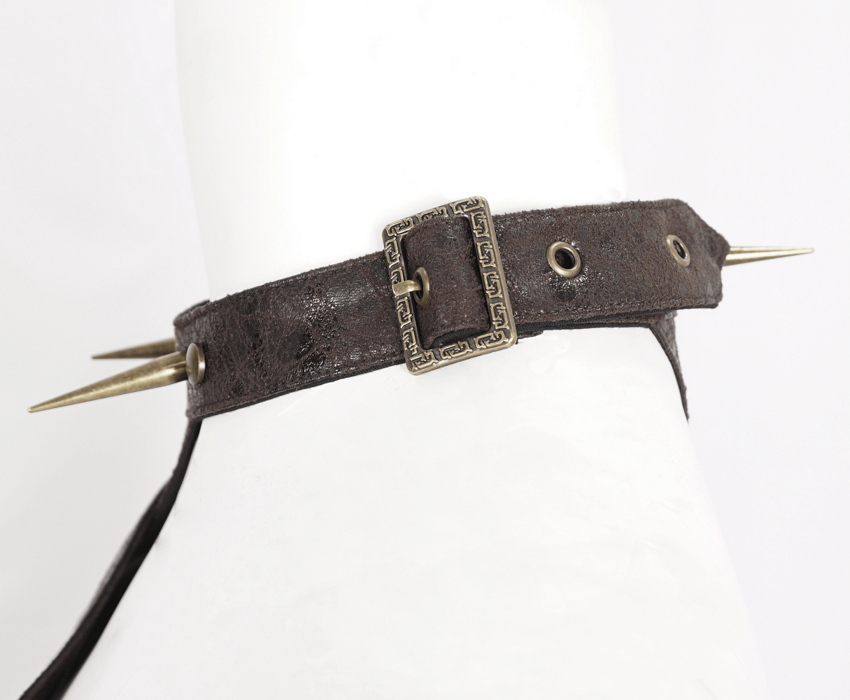 Dramatic gothic one-shoulder accessory featuring spikes and studs, perfect for adding an edgy vibe to your wardrobe.