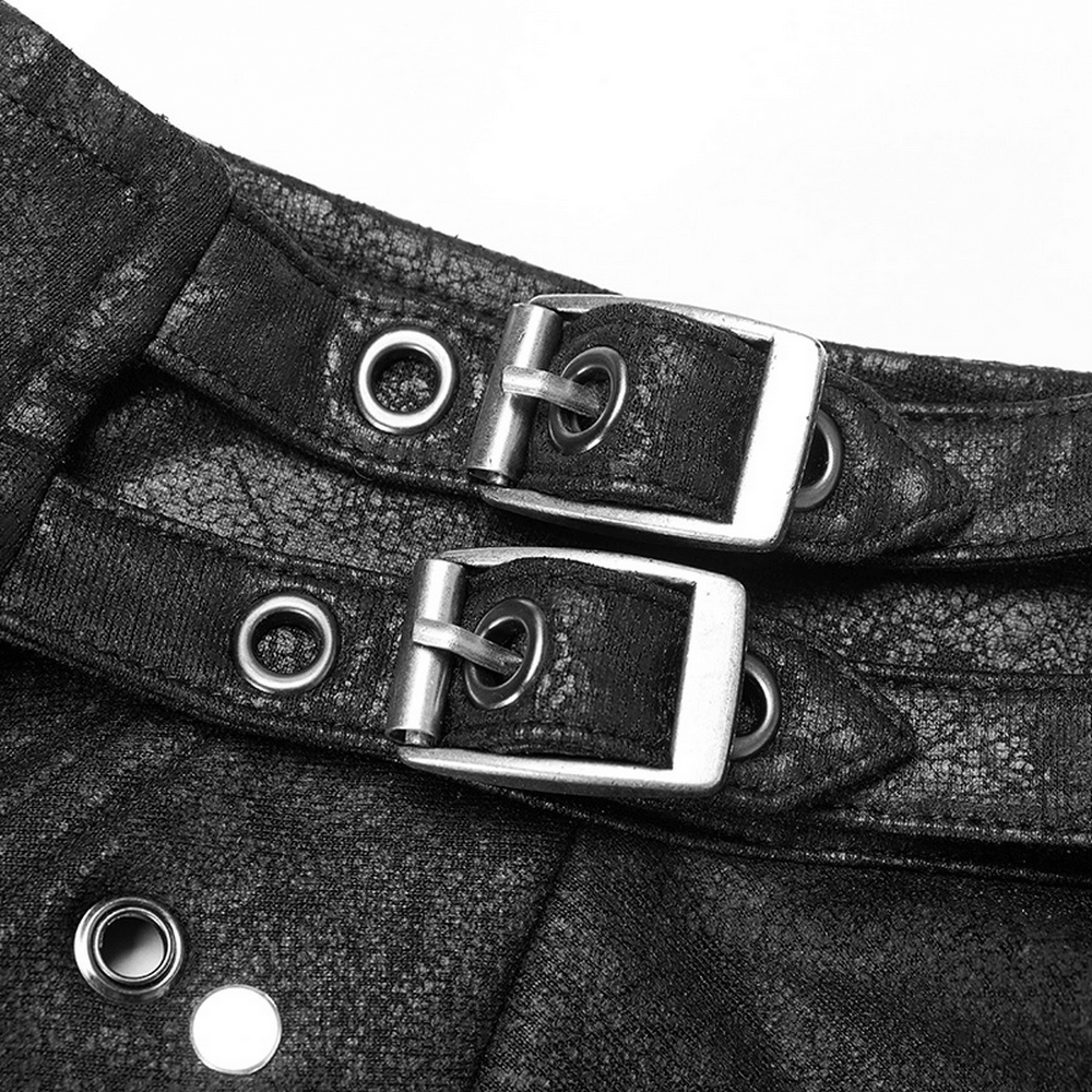 Close-up of buckles and straps on a one-shoulder faux leather punk jacket, showcasing edgy gothic design.