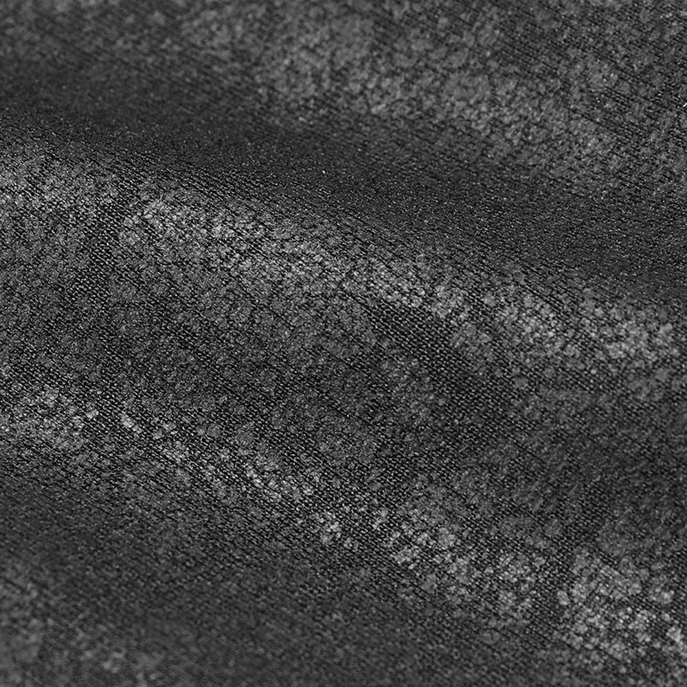 Close-up of textured black micro-elastic knitted crack fabric for punk fashion clothing.