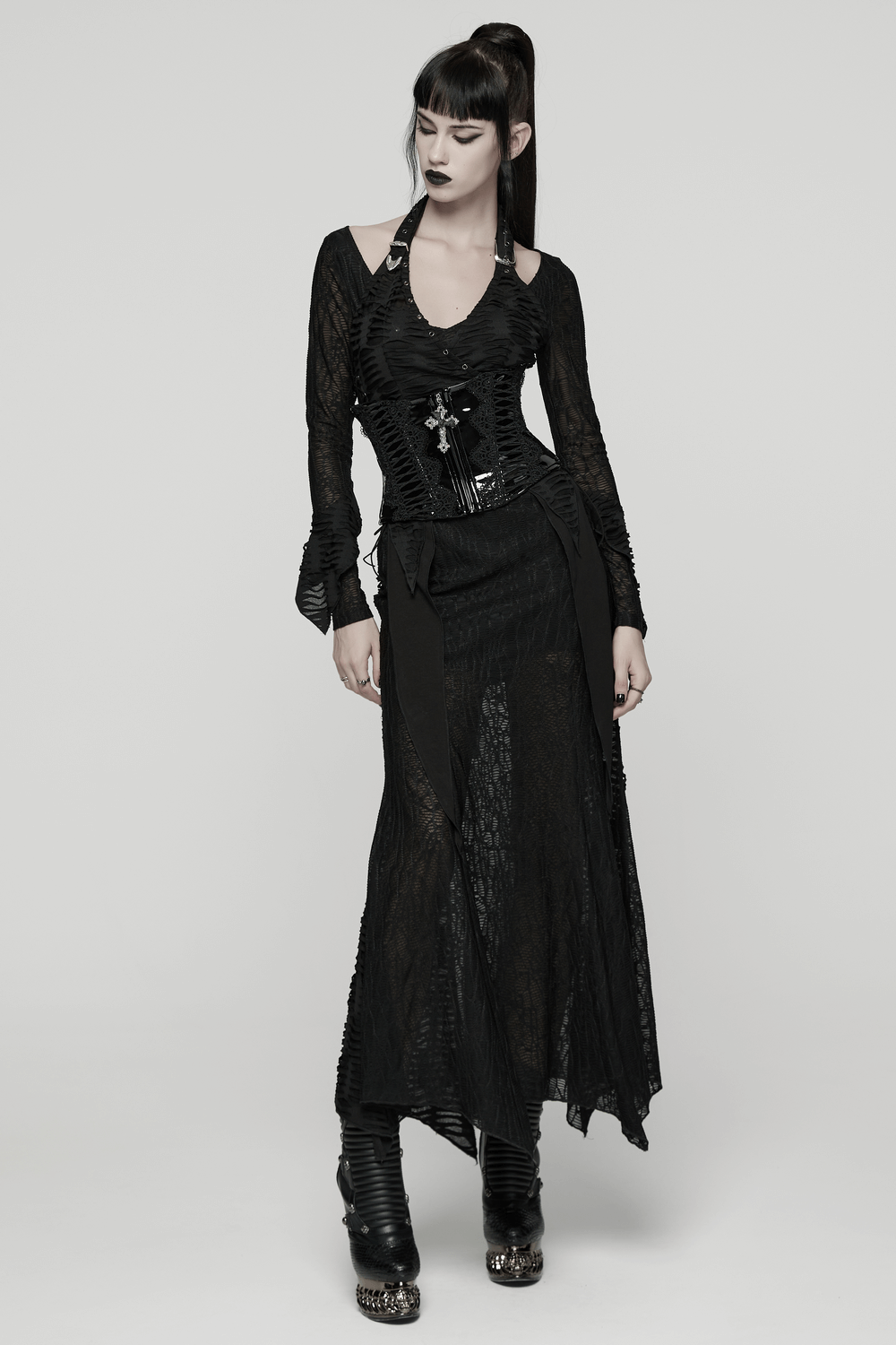 Patent Leather Corset Belt with Lace Trim and Pendant worn with a gothic outfit featuring lace and a dramatic silhouette.