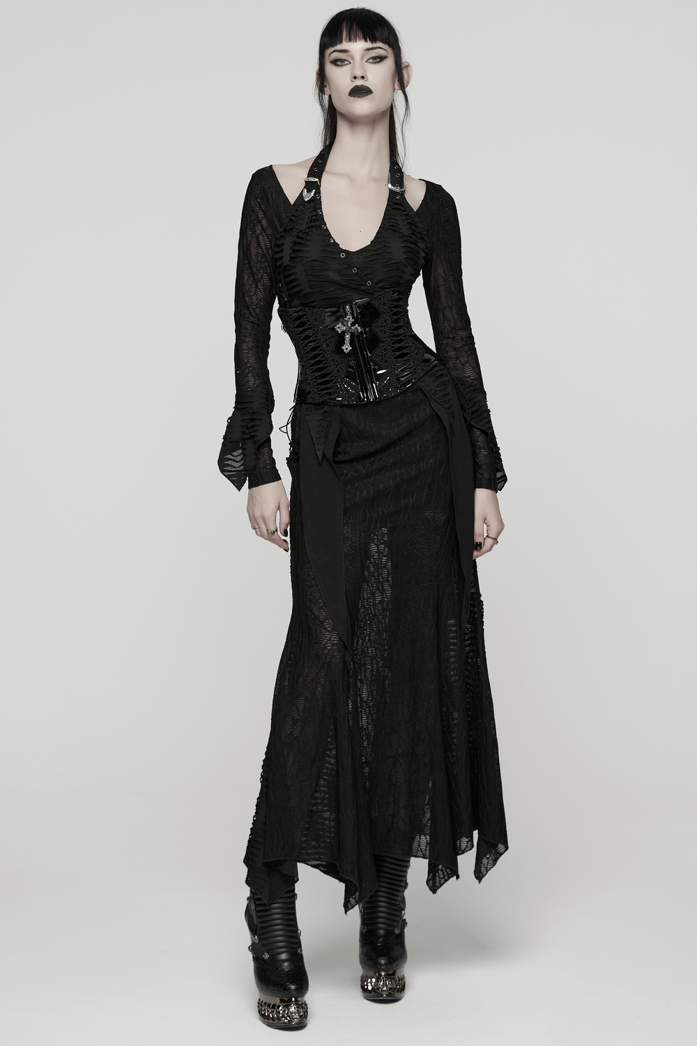 Goth model showcasing a Patent Leather Corset Belt with Lace Trim and Pendant, radiating dark elegance.